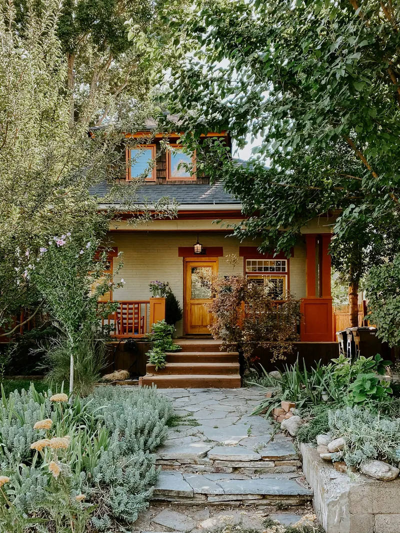 Craftsman house with a stone path through a garden